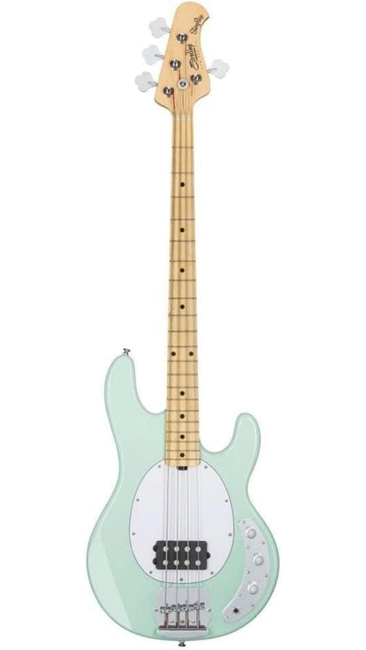 Electric bass guitar with a light green body and white pickguard on a white background